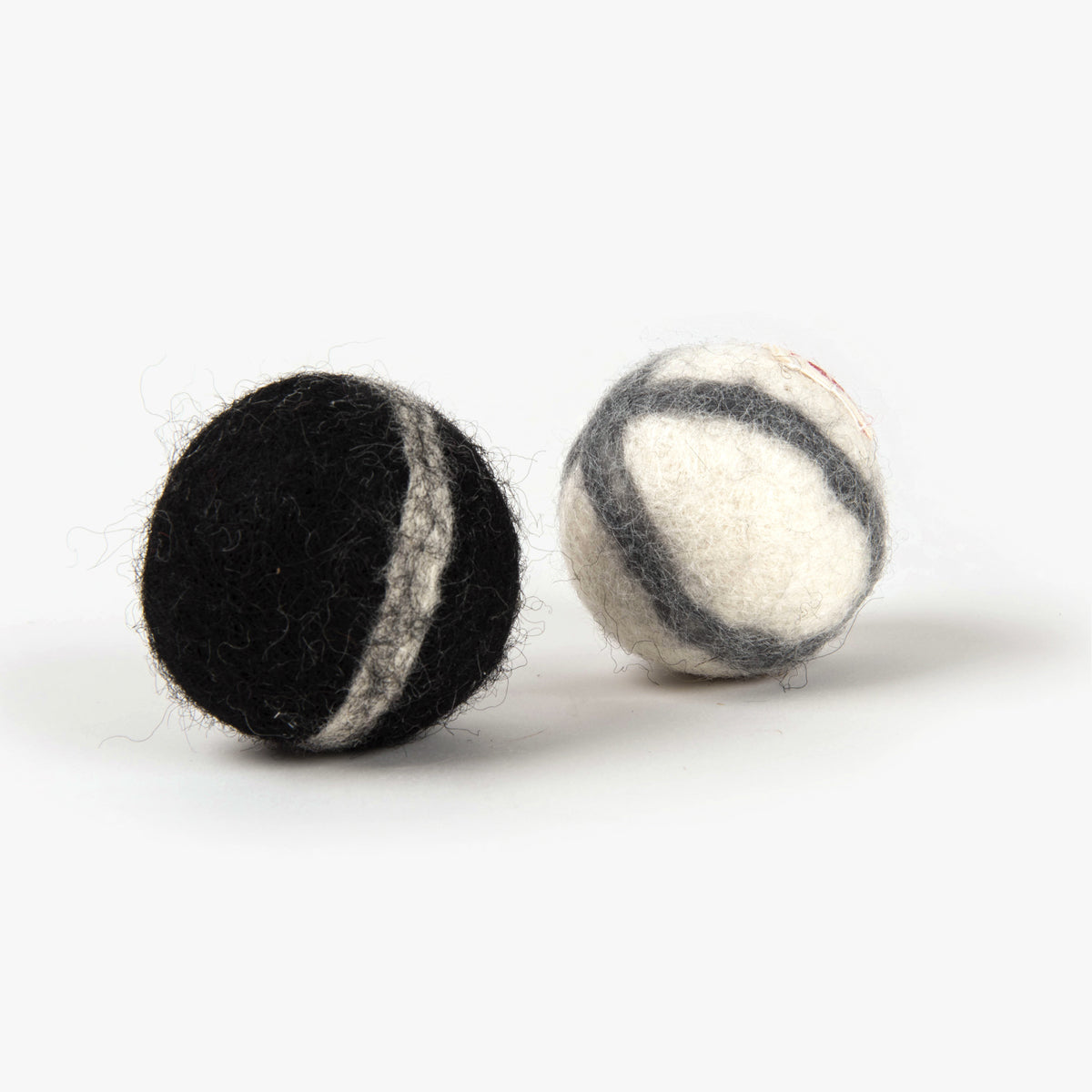 Profeline Woolly Balls With Rattle, Cat Toy In Black & White Wool Felt | at Made Moggie 